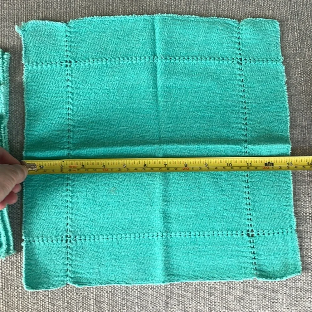 A set of four -3” square cotton napkins. Very soft.